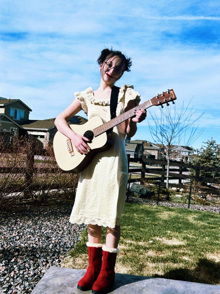 Hannah with a guitar